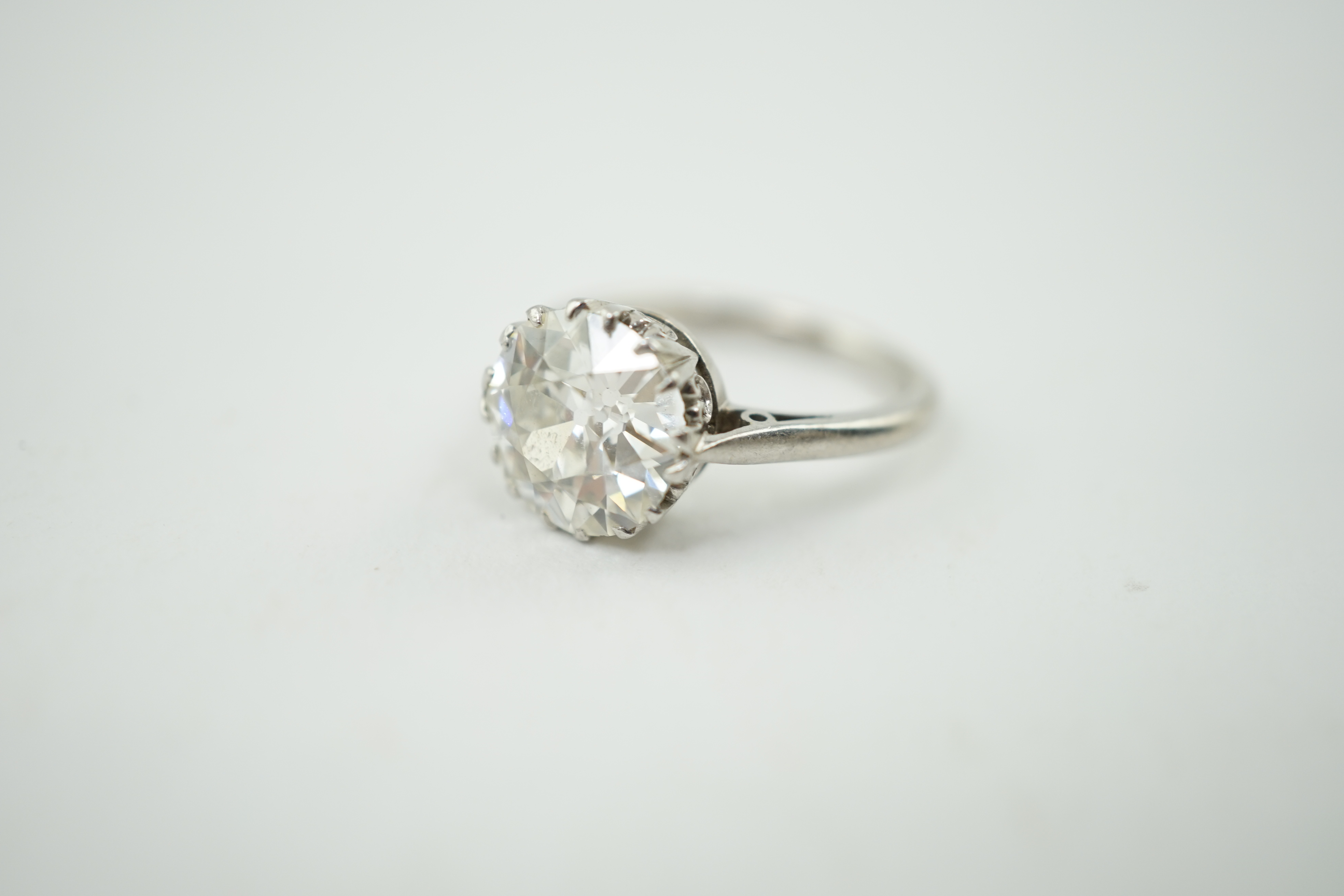 A platinum and solitaire diamond set ring